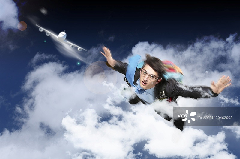 年轻商人背降落伞飞行概念图图片素材