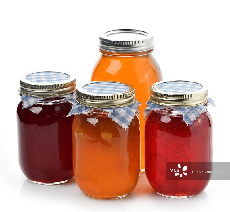 玻璃罐装自制橘子酱、果酱和蜂蜜图片素材