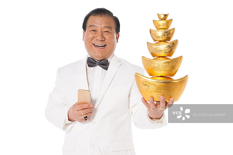 成功男人拿着金元宝图片素材