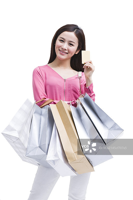 年轻女孩刷卡购物图片素材