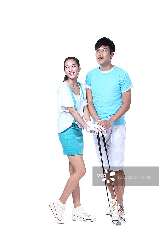 练习高尔夫的青年男女图片素材