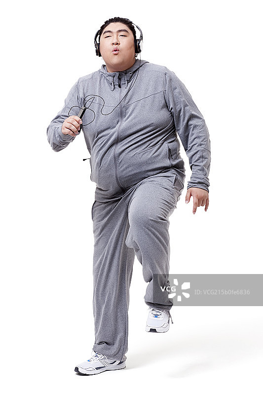 时尚的胖子听音乐跳舞图片素材