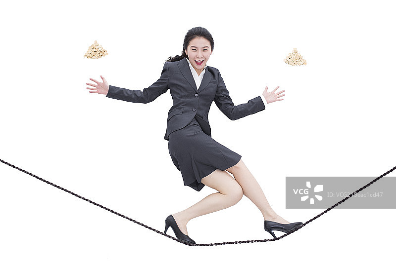 商务女士走钢丝图片素材