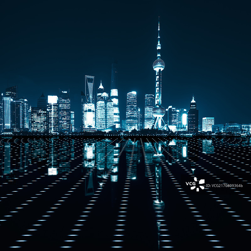 科技感和新能源感上海陆家嘴摩天大楼夜景和地面光效果图片素材