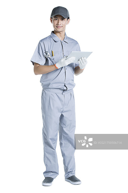 修理工拿着平板电脑图片素材