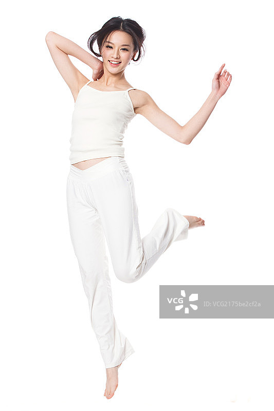 跳跃的青年美女图片素材