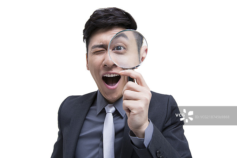 商务男士与放大镜图片素材