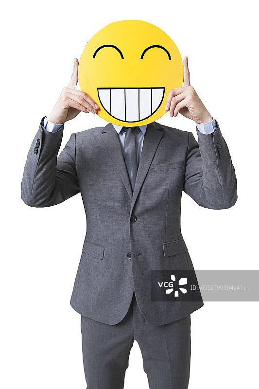 年轻商务男子戴着卡通笑脸图片素材
