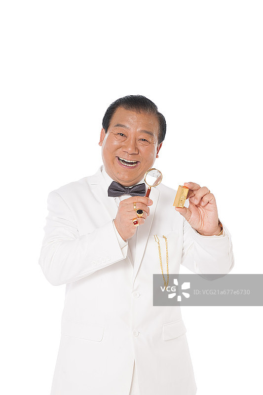 成功男人拿着放大镜图片素材