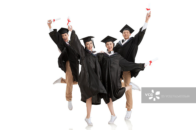 中学生穿着学士服跳跃图片素材