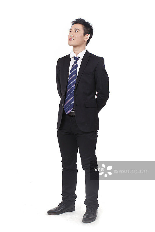 一个双手背后的商务男士图片素材