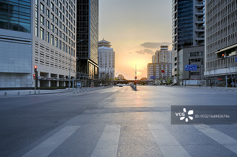 日落时分的北京CBD摩天大楼和广场道路图片素材