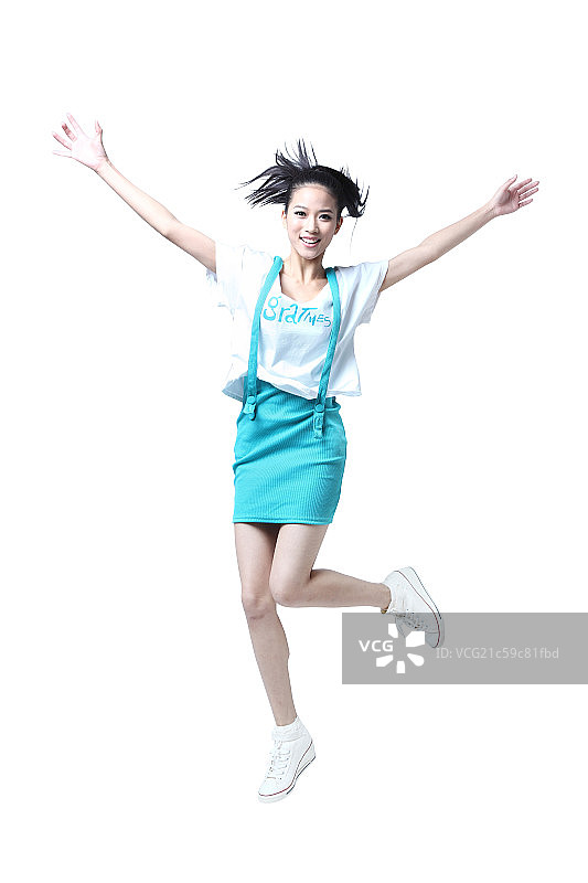 跳跃的年轻女人图片素材