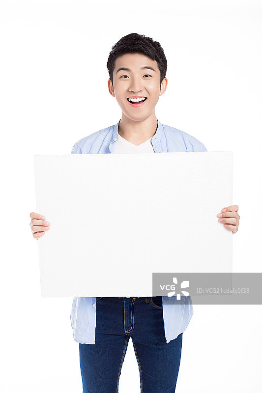 青年男子手拿白板图片素材