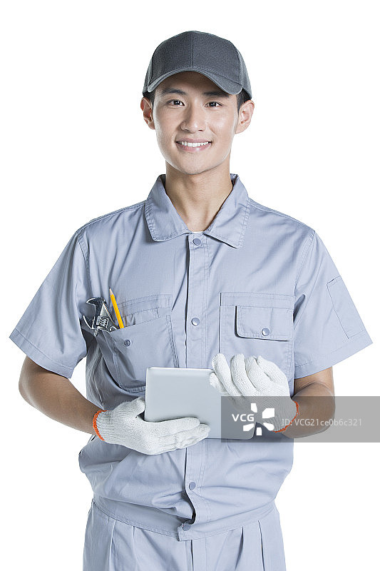 修理工拿着平板电脑图片素材