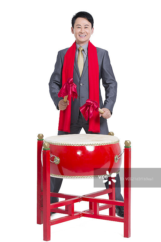 商务男士击鼓庆祝新年图片素材
