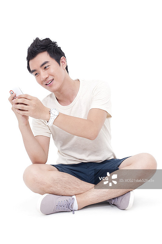 快乐年轻男子和手机图片素材