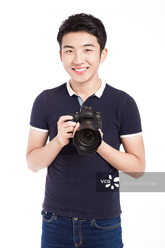 拿着相机的男青年图片素材