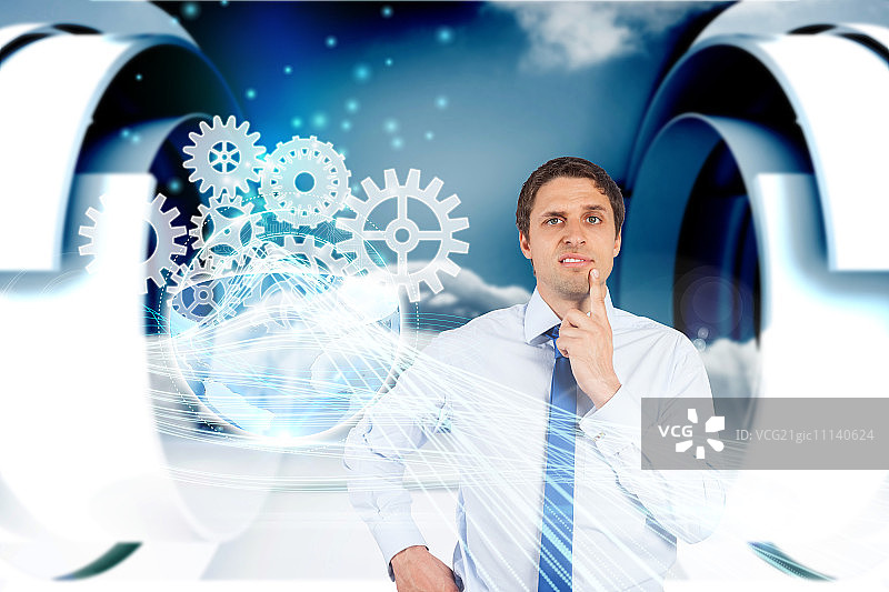 困惑的商人与齿轮图形合成图图片素材