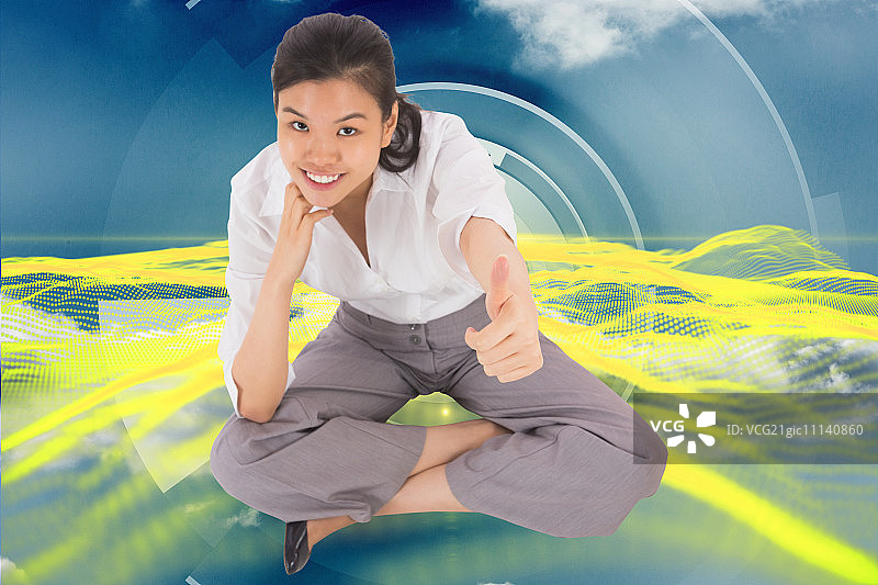 女商人盘腿而坐，竖起大拇指，背景为蓝白色抽象黄色设计图片素材