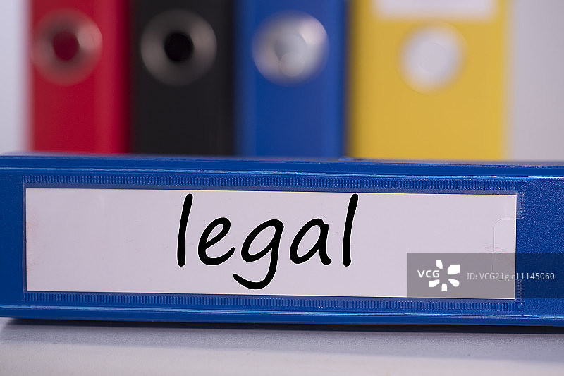 蓝色商务活页夹上的“法律”字样图片素材
