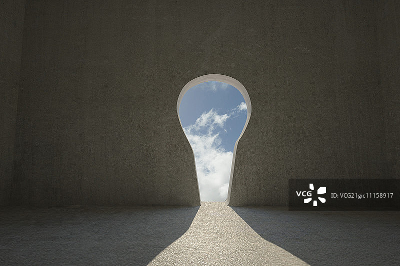 黑暗房间里有光照进的锁眼门图片素材