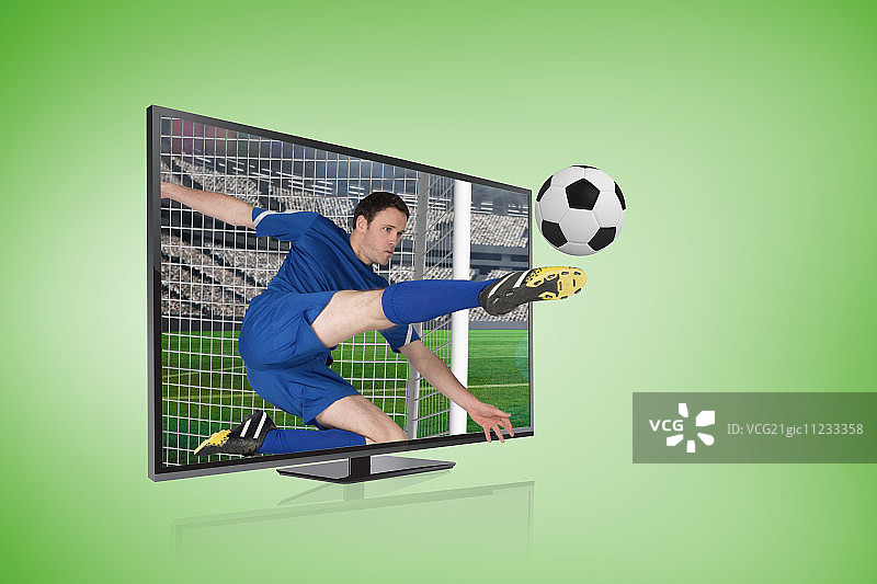 蓝色足球运动员踢球穿过电视屏幕的合成图像图片素材