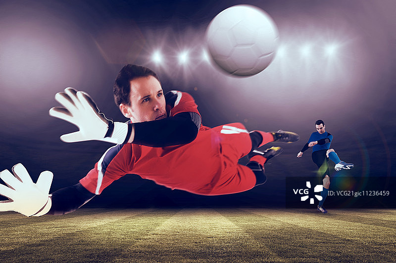 守门员在聚光灯下跃起，足球场背景图片素材