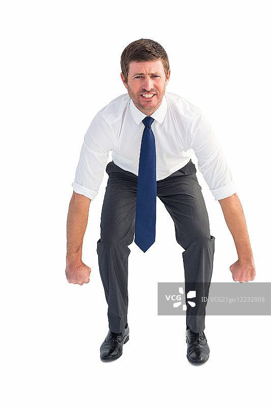 在白色背景下弯腰抬举的商人图片素材