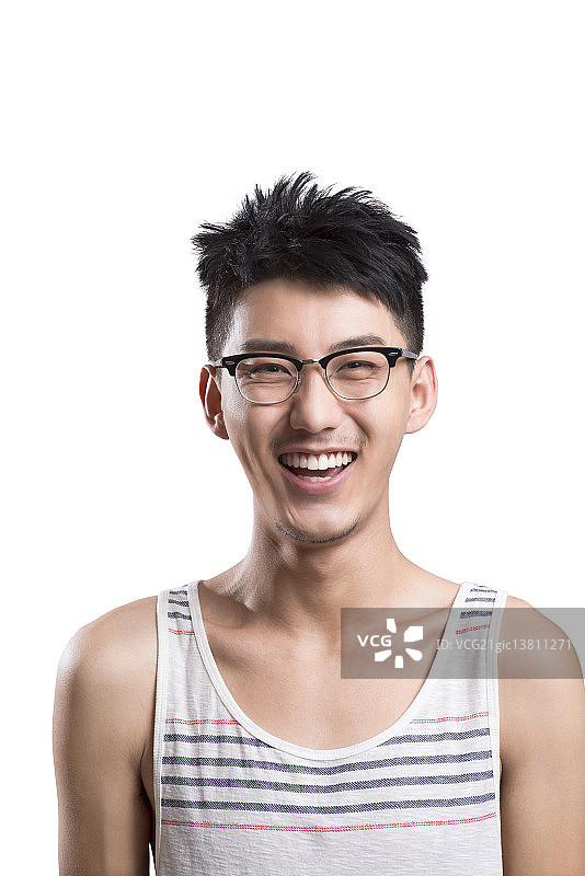 Portrait of young man laughing图片素材