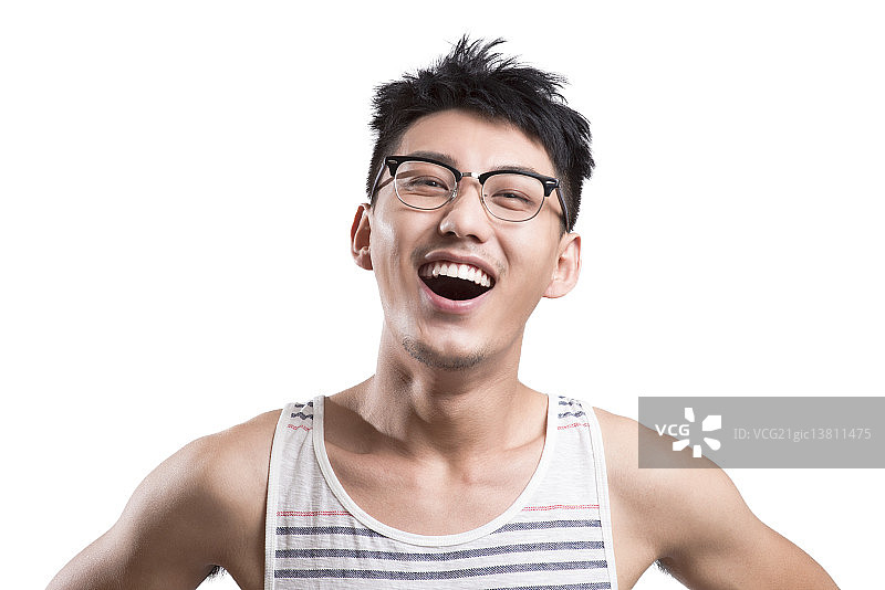 Portrait of young man laughing图片素材