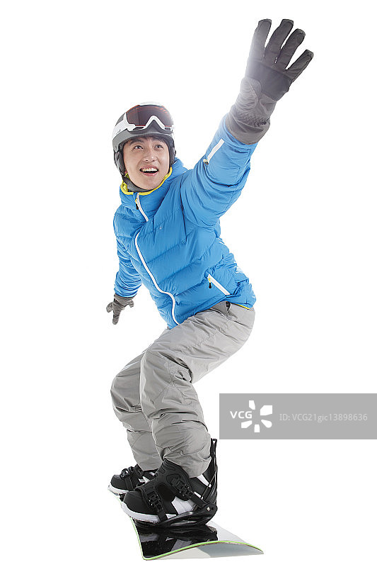 欢乐的青年男人滑雪图片素材