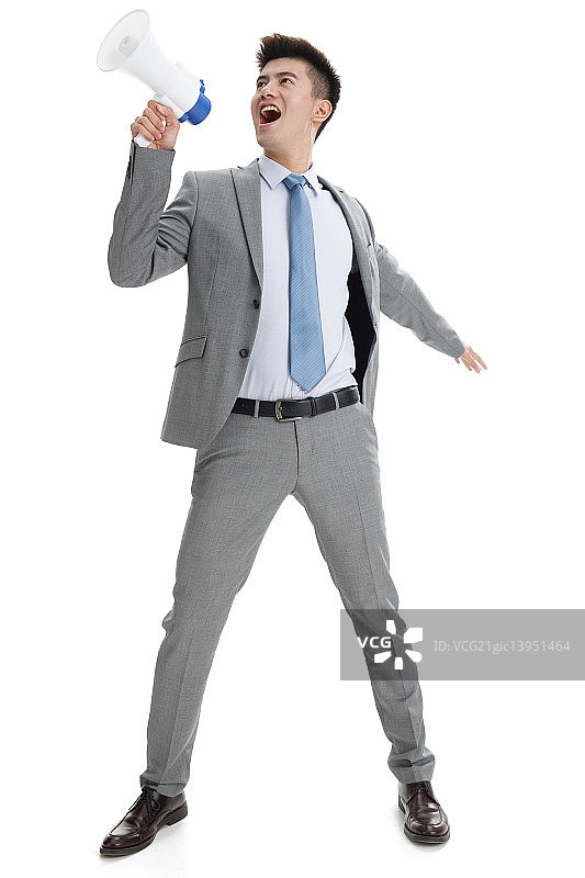 商务青年男人拿着扩音器呼喊图片素材