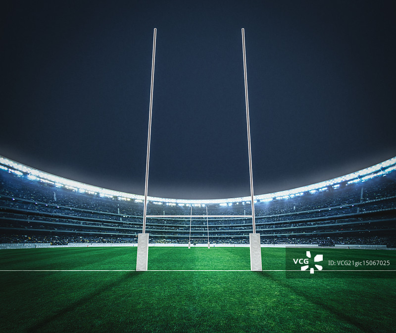 夜晚体育场内的橄榄球球门图片素材