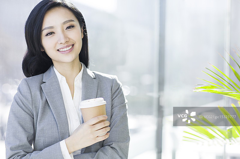 商务女士喝咖啡图片素材