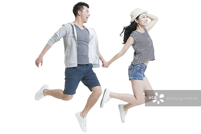 快乐的年轻情侣飞翔图片素材