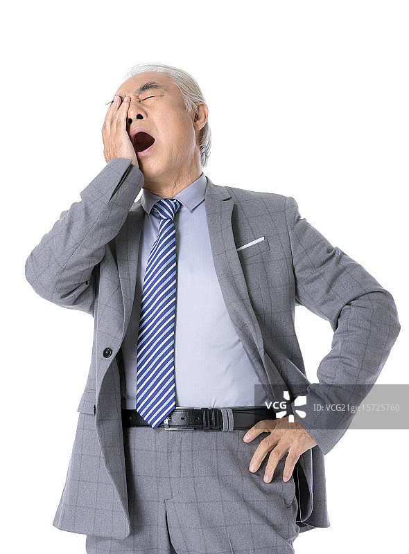 打哈欠的老年商务男性图片素材