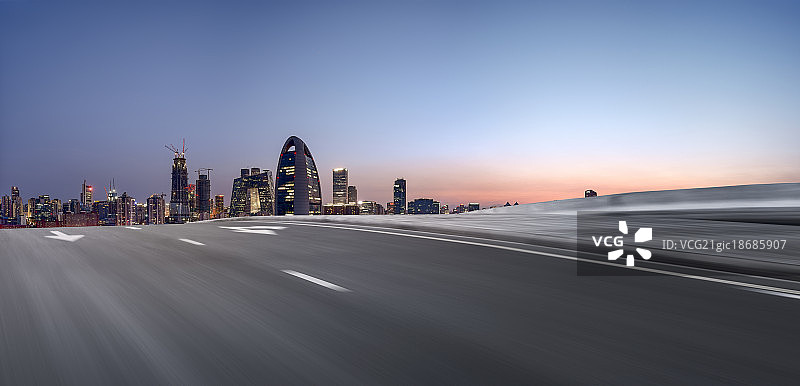 日落时分的北京CBD都市风景和道路速度特效图片素材