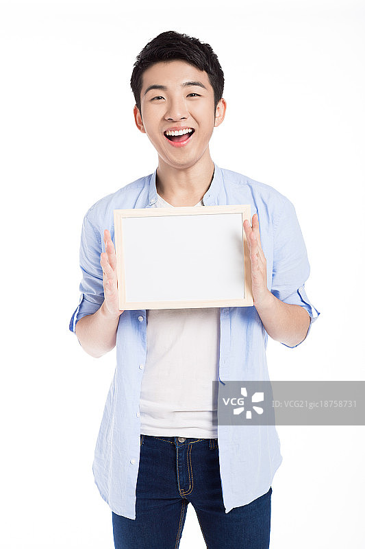 男孩拿着小巧的写字板图片素材