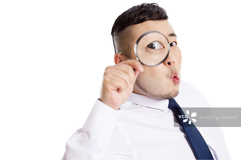 商务男士拿着放大镜图片素材