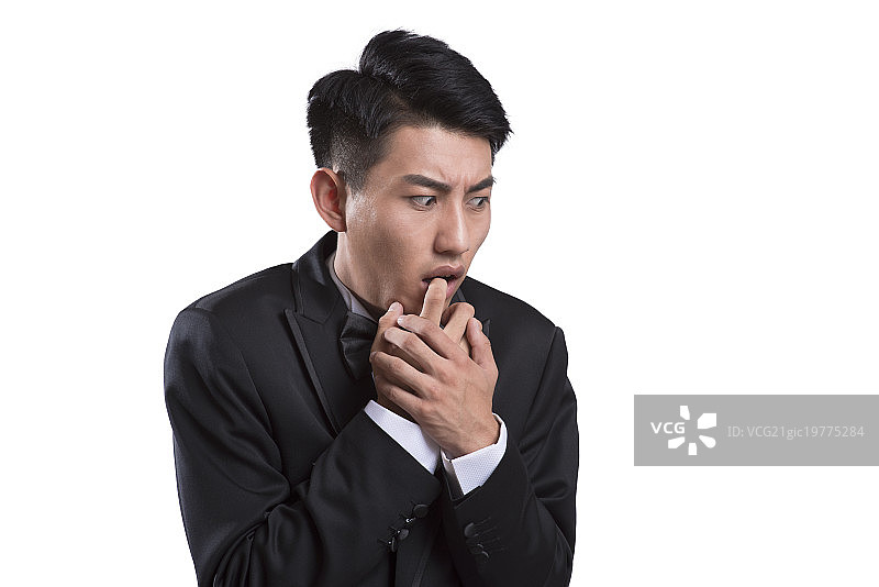 Portrait of young groom in shock图片素材