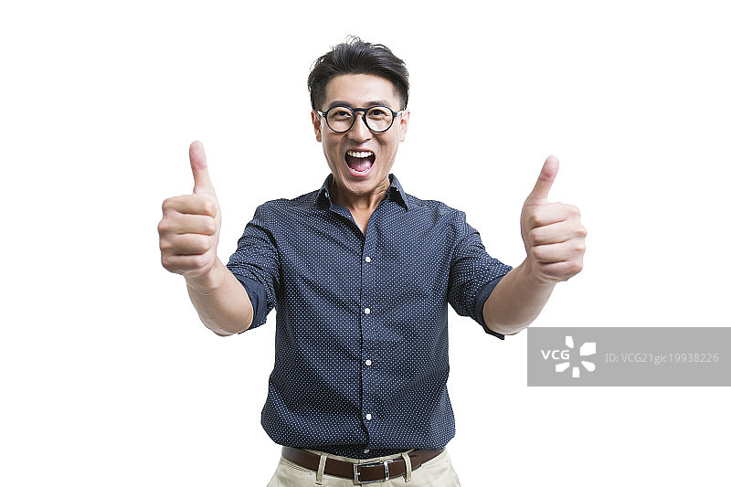 快乐的年轻男子竖起大拇指图片素材