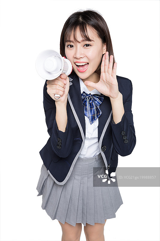 年轻女孩手拿扩音器呐喊图片素材