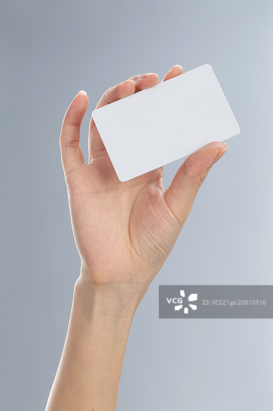 手拿卡片图片素材
