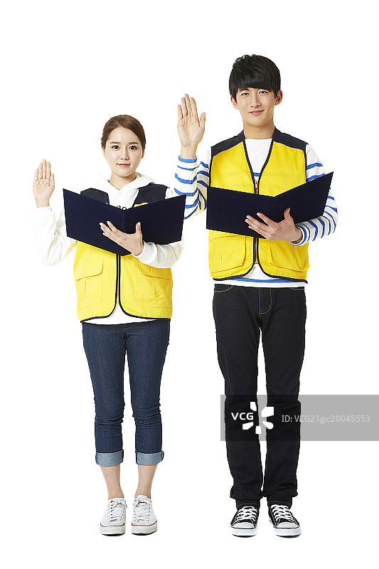 志愿者举起右手宣誓图片素材