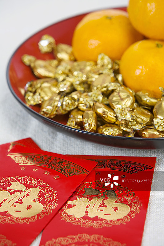 橘子，糖果和红包图片素材