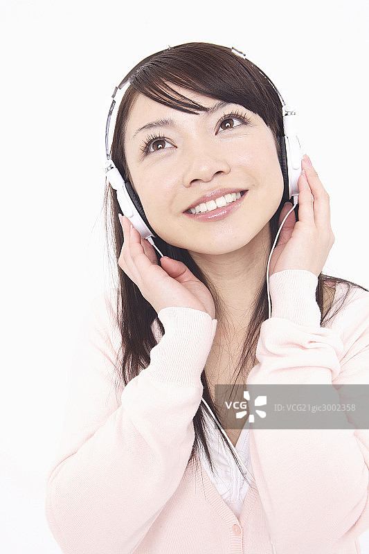亚洲女人听音乐图片素材
