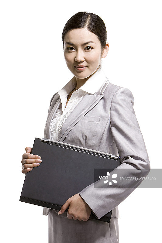 商务女士手拿笔记本电脑图片素材