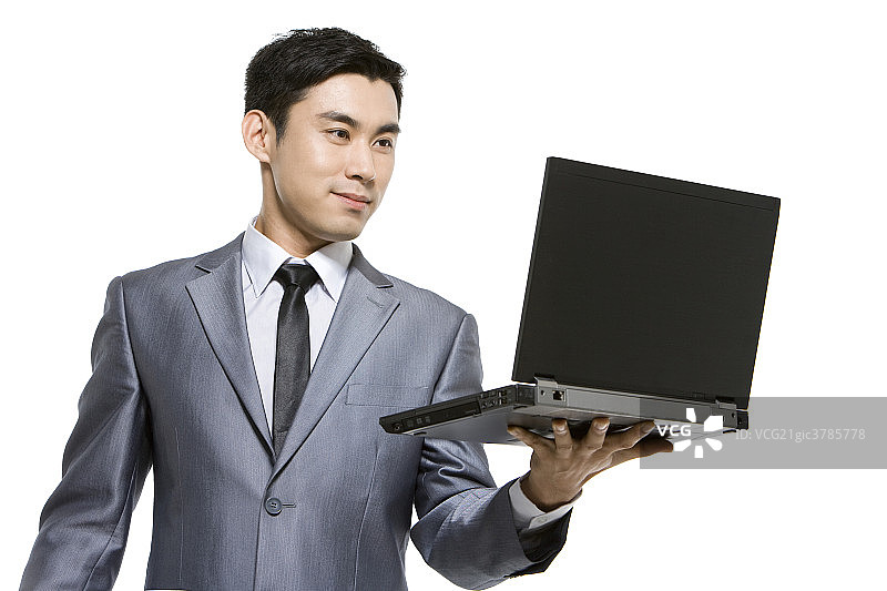 商务男士手拿笔记本电脑图片素材