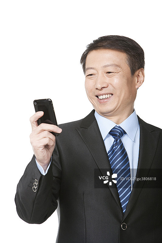 中年商务男士用手机图片素材